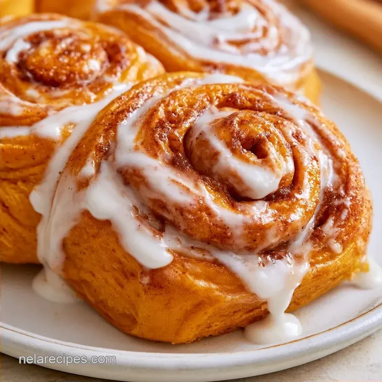 Pumpkin Cinnamon Rolls with Powdered Sugar Icing